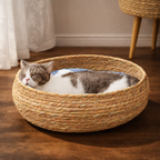 Cat lying in a woven pet bed