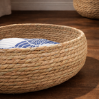 Straw oven basket with a blue and white cushion