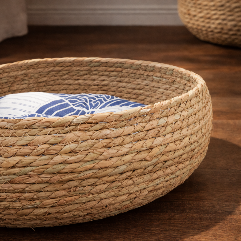 Straw oven basket with a blue and white cushion